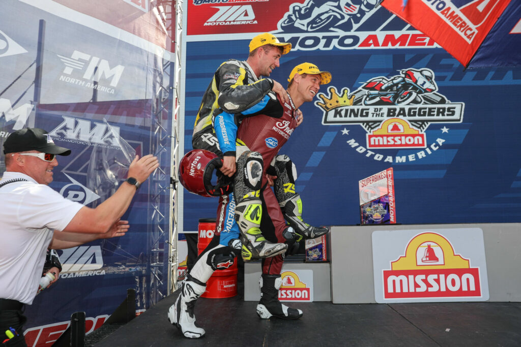 Troy Herfoss carried Max Flinders onto the podium after Race Two. Photo by Brian J. Nelson.