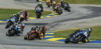 Jake Gagne (1) leading Mathew Scholtz (11), Cameron Beaubier (6), Cameron Petersen (45), Josh Herrin (2), PJ Jacobsen (99), Toni Elias (24), Richie Escalante (behind Elias), Corey Alexander (23), and the rest of the field during MotoAmerica Superbike Race One at Road Atlanta in 2023. Photo by Brian J. Nelson.