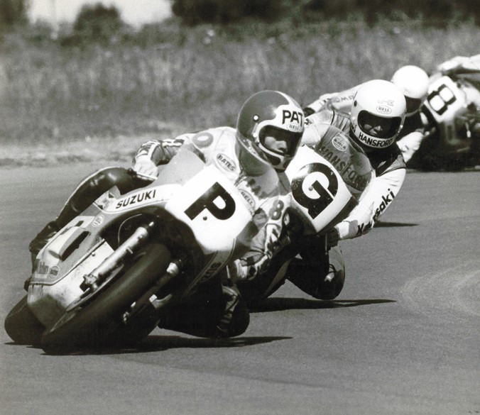 Pat Hennen (P) on a Suzuki TR750 holds off the late great Gregg Hansford (G) and his Kawasaki KR750 and Hansford's Team Kawasaki Australia teammate Murray Sayle in one of their torrid battles during the New Zealand Marlboro International Series in the 1970s. Photo by Rhys Jones.