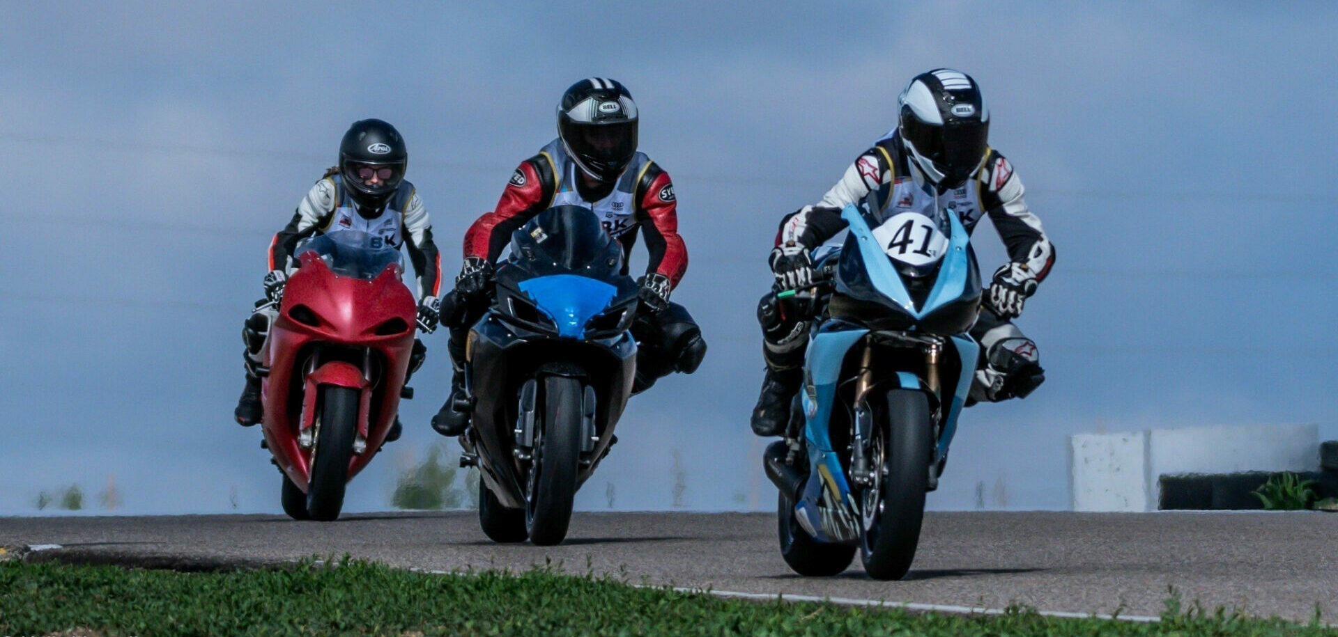 Middleweight veteran racer Brett Laveque (41) leads two students through their mid day paces.