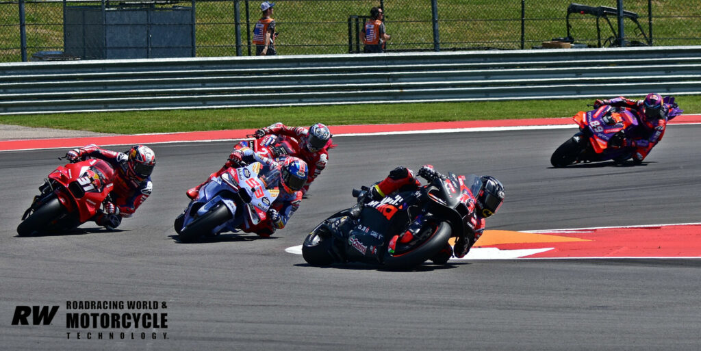 Maverick Vinales (12) leads Marc Marquez (93), Pedro Acosta (31), Enea Bastianini (behind Marquez), and Jorge Martin (89) during the MotoGP Tissot Sprint Race at COTA. Photo by Michael Gougis.