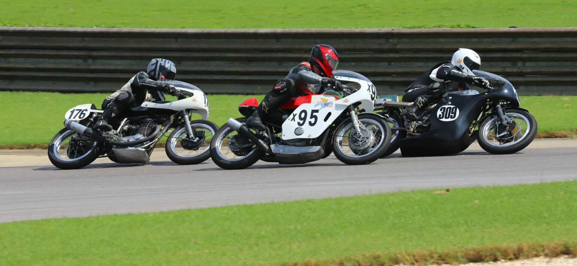 AHRMA racers Tony Read (176), Andrew Mauk (95), and Tim Joyce (309). Photo by etechphoto.com, courtesy AHRMA.