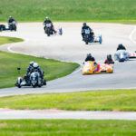 Pilot Daniel May and passenger Craig Chawla (93) lead a combined sidecar race at the AHRMA event at Nelson Ledges. Photo by Cathy Drexler, courtesy AHRMA.