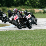 Mark Smithard (666), Will Meyer (15), Steven Filippini (44), Stephen Aretz (44X), Ralph Wessell (81), and Grant Spence (24) as seen during the combined Novice Historic Production Heavyweight/Class C Handshift/Class C Footshift race at Talladega Gran Prix Raceway. Photo by Felecia Foxx, courtesy AHRMA.