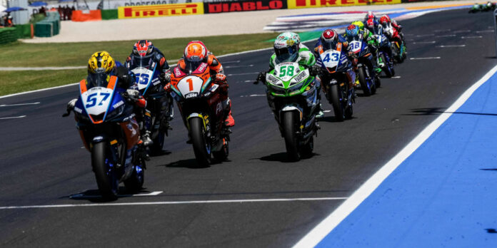 Aidi Satya Mahendra (57) leads Galang Hendra Pratama (56), Jeffrey Buis (1), Inigo Iglesias Bravo (58), and the rest of the WorldSSP 300 field during Race Two at Misano. Mahendra won the race. Photo courtesy Dorna.