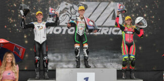 Avery Dreher, 17, (left) and Ella Dreher, 14, (right), when they made history by both finishing on the MotoAmerica Junior Cup podium at Brainerd. Matthew Chapin (center) won the rain-shortened race. Photo by Brian J. Nelson.