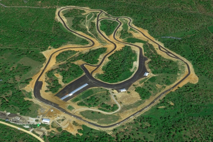 An aerial view of Ozarks International Raceway in its early days. The long building in the interior is a 58-day garage, and the paved area around it now connects the inner and outer sections, serving as a paddock for both. The track runs in a clockwise direction. Photo courtesy ASRA and Evolve GT.