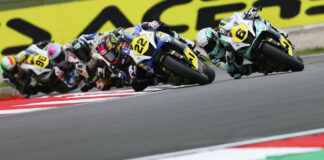 Ana Carrasco (22) and Maria Herrera (6) lead the field early in WorldWCR Race One at Donington Park. Photo courtesy Dorna.