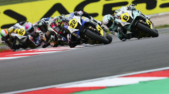 Ana Carrasco (22) and Maria Herrera (6) lead the field early in WorldWCR Race One at Donington Park. Photo courtesy Dorna.