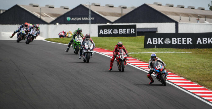 Toprak Razgatlioglu (54) leads Nicolo Bulega (11), Scott Redding (45), Alex Lowes (22), and the rest at Donington Park. Photo courtesy Dorna.