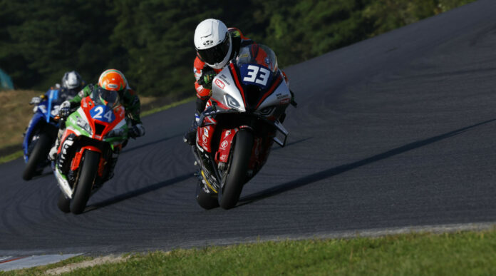 American Zechariah "Zech" Dzegede (33) in action at Autopolis. Photo courtesy TONE RT SYNCEDGE 4413 BMW.