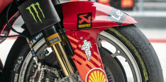 The front end of a Ducati Lenovo MotoGP racebike, featuring Brembo finned discs and advanced calipers; a forged magnesium wheel from Brembo subsidiary Marchesini; and front forks from Brembo subsidiary Ohlins. Brembo photo.