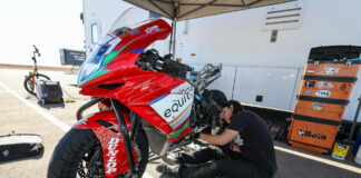 Melissa Paris working on an MV Agusta F3-800