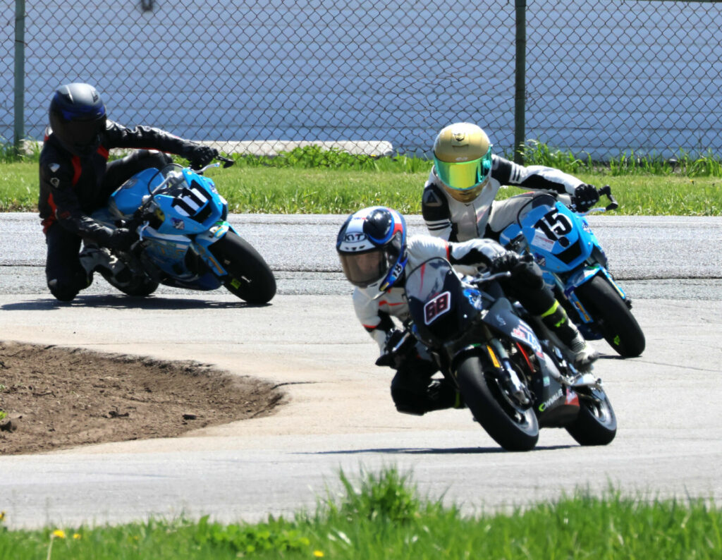 Start of race two for Motul MiniSBK at Shannonville Motorsport Park, with No. 68 Jager Stockill, the eventual victor, leading the similar Ohvale 160s of No. 15 Stefan Tanasic and No.111 Eric Sergi.Image by Colin Fraser