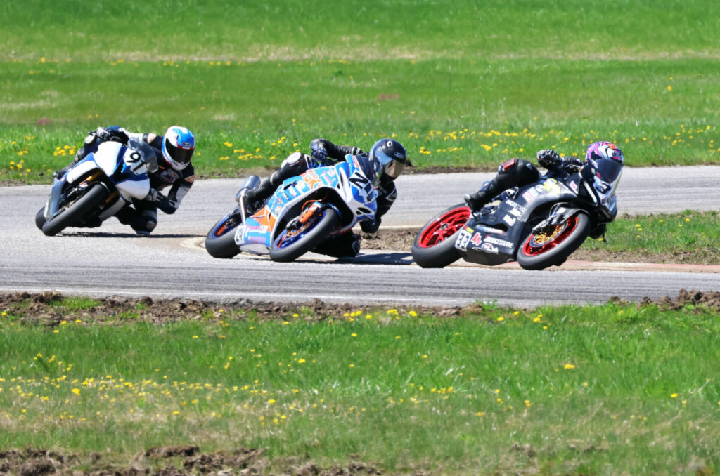 In the middleweight divisions, National stars ran up front: pictured in the Heavyweight race, No. 33 Econo Lube Ducati of Elliot Vierra heads National Champ No. 24 Suzuki of Seb Tremblay and the No. 91 Yamaha of unretired Matt Simpson. Photo by Colin Fraser.