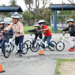 Kindergarten students taking part in the All Kids Bike program with Strider balance bikes. Photo courtesy All Kids Bike.