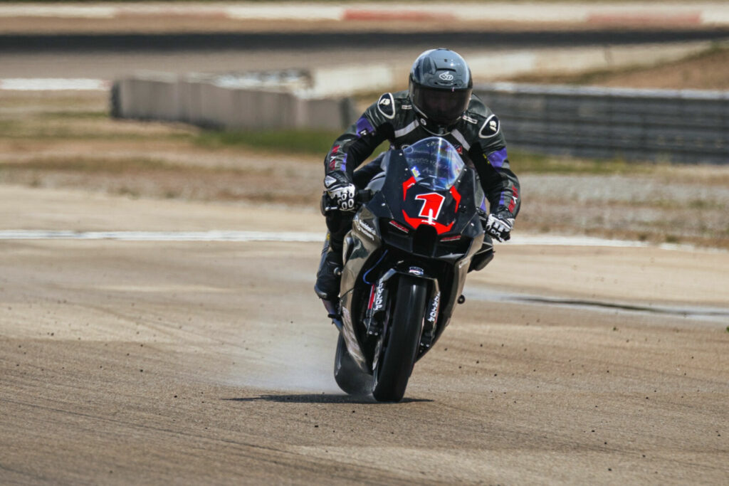 Anthony Norton trying to cool his rain tires on a drying track during the KOM Race. Photo courtesy Richard Jellerson