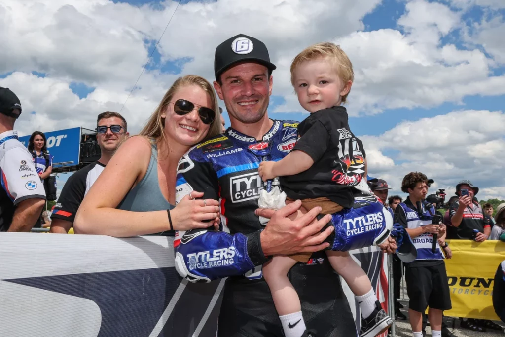 The Beaubier family - Shelby, Cameron, and Brody - celebrate in the Road Atlanta winner's circle. Photo by Brian J. Nelson