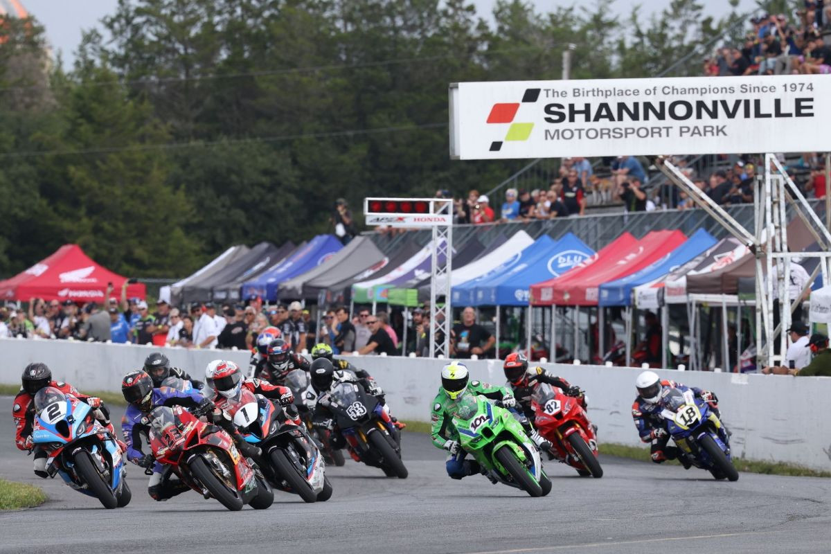 The GP Bikes Pro Superbike riders heads into turn one at Shannonville Motorsport Park last September. The field will look a little different when the 2025 season kicks off at the Ontario circuit this weekend - most notably, champion Ben Young's (1) switch to Honda and Alex Dumas (23) making the change to BMW. Photo by Rob O'Brien / courtesy CSBK