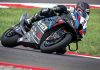 Sam Fleming on Toprak’s World Superbike. Note the cups on the axles for the quick change wheels to enable the team to leave the tires in the warmer ovens until the last possible second before the bike goes onto the track, the finned front calipers with dry-break lines, and lots and lots of radiator.