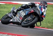 Sam Fleming on Toprak’s World Superbike. Note the cups on the axles for the quick change wheels to enable the team to leave the tires in the warmer ovens until the last possible second before the bike goes onto the track, the finned front calipers with dry-break lines, and lots and lots of radiator.