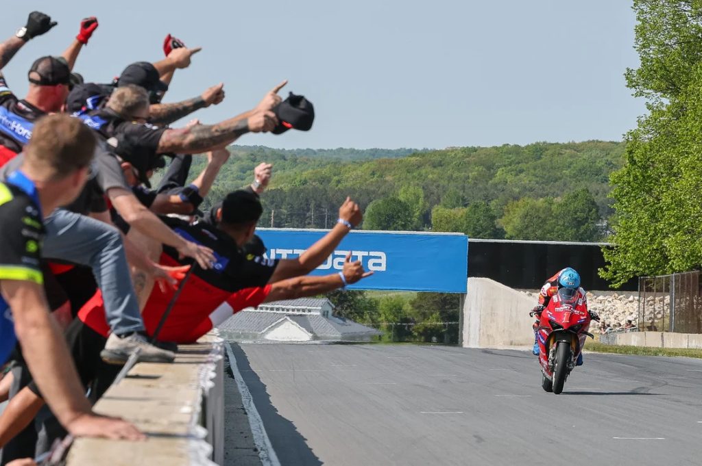 Herrin heads to the finish line with his second win of the weekend at Road America much to the joy of his Ducati crew. Photo by Brian J. Nelson