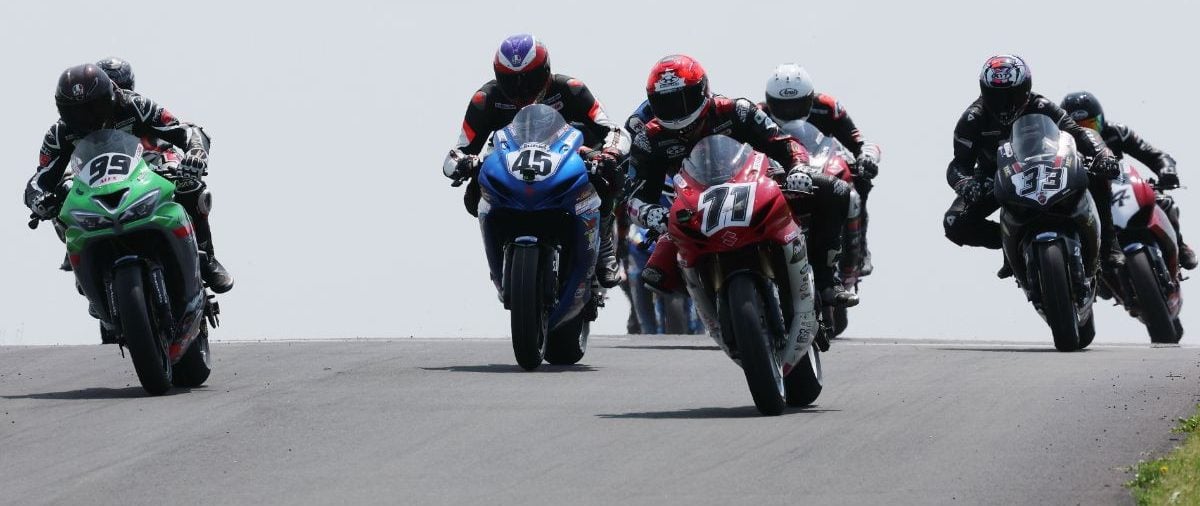 Torin Collins (71) leads the Pro Supersport field into turn one at Atlantic Motorsport Park Sunday afternoon and went on to win by just over three seconds ahead of Andrew Van Winkle (45) and Sebastien Tremblay (hidden). Photo by Rob O'Brien / courtesy CSBK