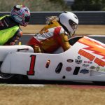 A vintage sidecar racing team.
