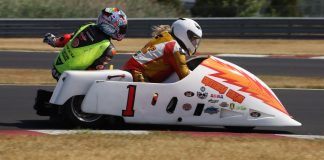 A vintage sidecar racing team.