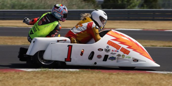 A vintage sidecar racing team.