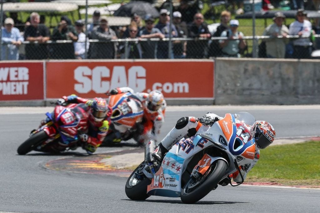 OrangeCat Racing riders Andrew Lee (No. 14) and Jayson Uribe (No. 36) compete against another rider for the race lead in a MotoAmerica Stock 1000 race at Road America. Photo credit: Brian J. Nelson