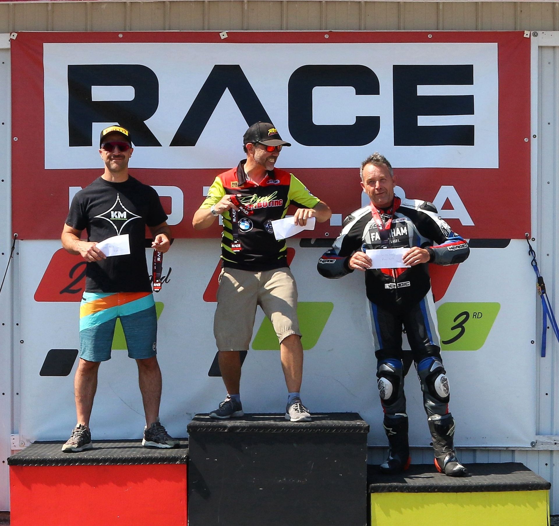 Pro Feature Podium with (left to Right) Milwaukee Yamaha’s Elie Daccache, Royal Distributing BMW winner Michael Leon and Farnham Lager Yamaha Ernest Bernhard.Image by Don Empey.
