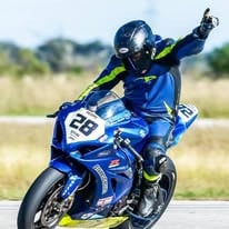 Pete Martins on his Suzuki machine when he was racing. Photo courtesy Advocate Veterinary Services.