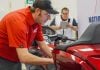 A Honda technician demonstrates skill and focus during the National Technician Contest. Photo courtesy American Honda Motor Co.