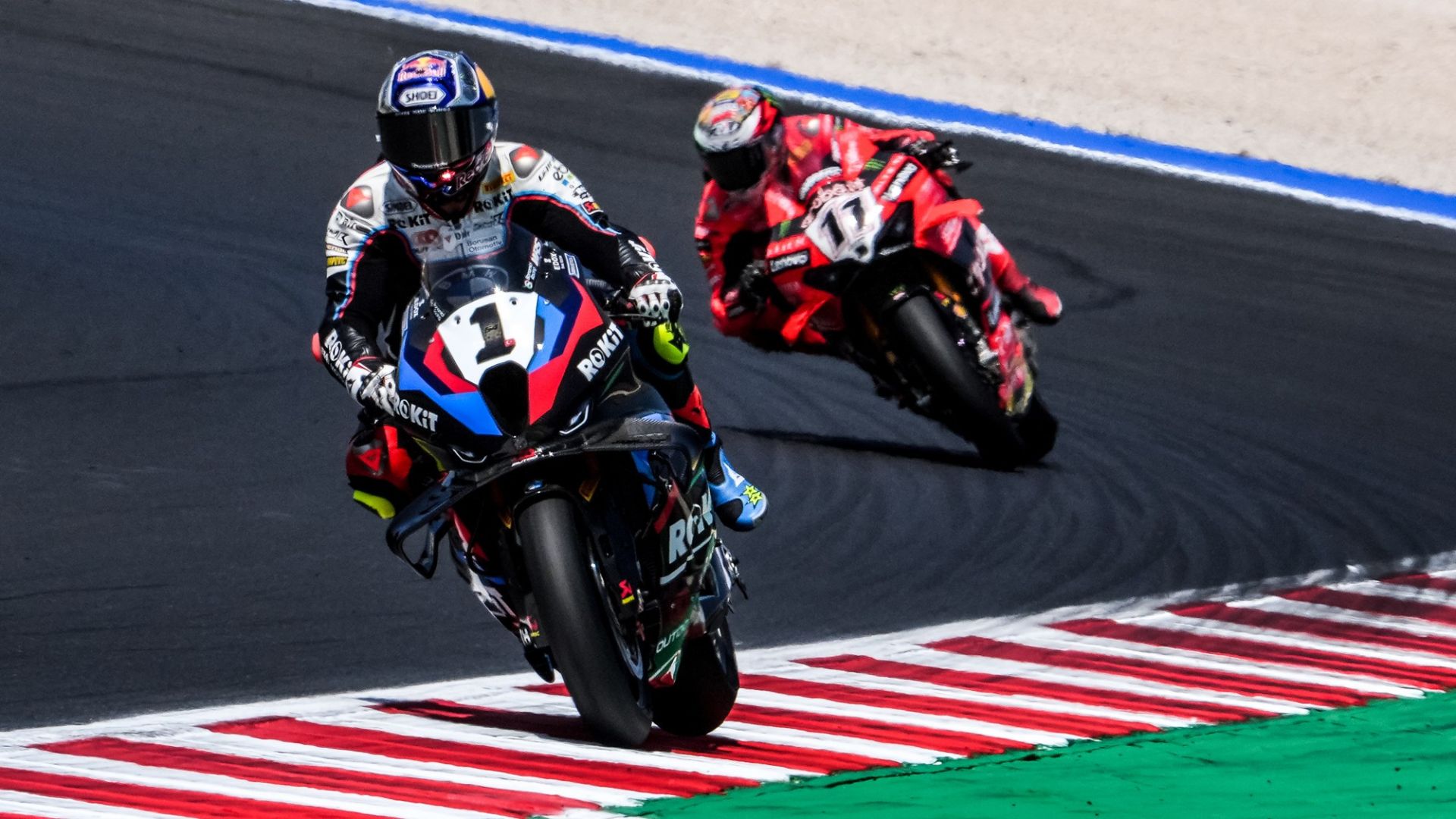 Toprak Razgatlioglu on his ROKiT BMW Motorrad WorldSBK Team (1) and Nicolo Bulega on his Aruba.it Racing - Ducati (11). Photo courtesy Dorna.