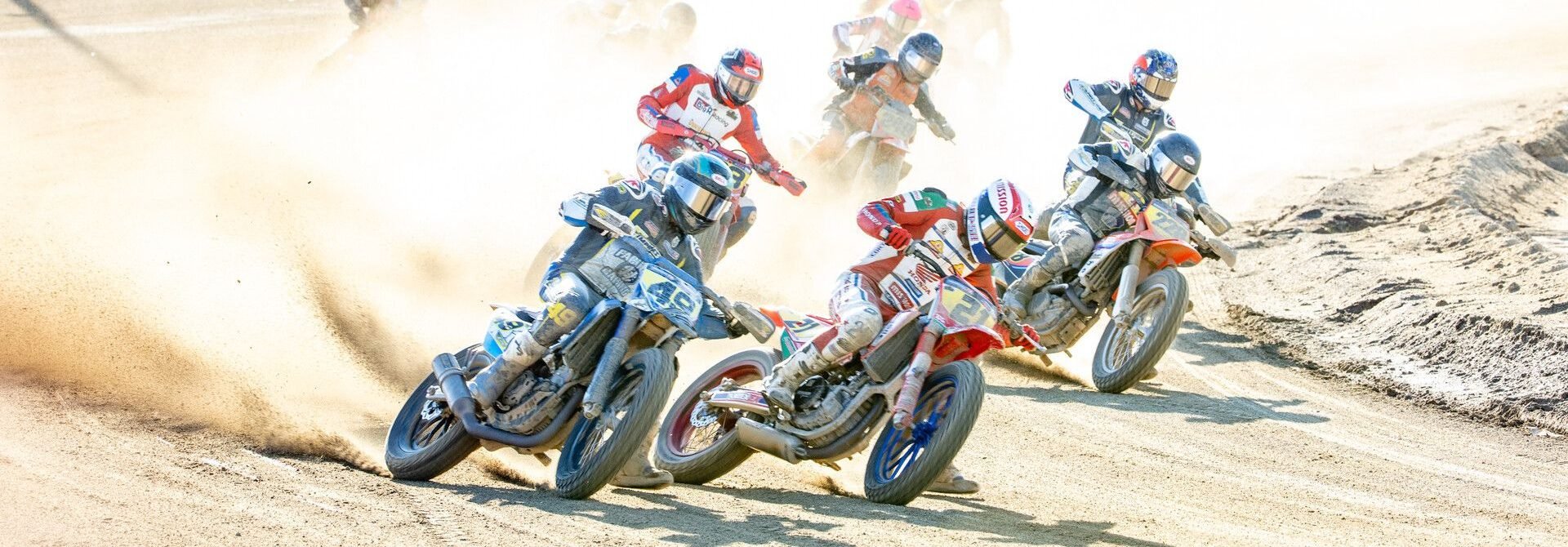 AFT Singles presented by KICKER riders Trevor Brunner (21), Chad Cose (49), Kage Tadman (228), and others race during heats at the Lima Half-Mile this past weekend. Photo credit: Tim Lester / courtesy American Flat Track.