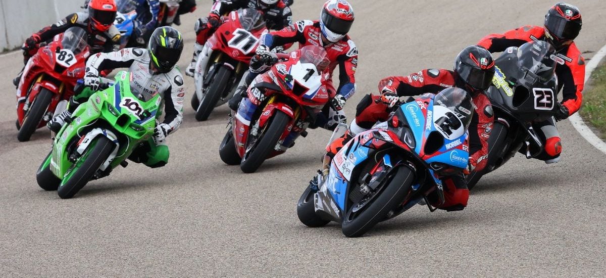 Sam Guérin (2) leads the Pro Superbike field into the first turn during race three action of the CSBK triple-header weekend at RAD Torque Raceway. Photo courtesy: Rob O'Brien / Courtesy CSBK.