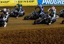 Mission AFT SuperTwins riders Briar Bauman (3), Dan Bromley (62), Davis Fisher (67), Trent Lowe (48), and others race during the Main Event at Lucas Oil Speedway Friday night. Photo by: Tim Lester / courtesy American Flat Track