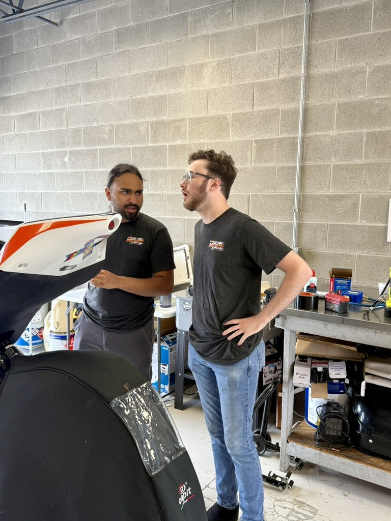 Thomas (left) and Snedigar (right) work on fellow Rose-Hulman student Solly Mervis’s Krämer APX-350 MA Talent Cup machine. Photo courtesy of Ice Barn Racing