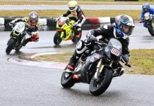 Race one of three, lap one, in the wet Motul FIM MiniGP Canada round two at Le Circuit Mont Tremblant in Quebec, and eventual triple winner No. 68 Jager Stockill, No. 91 Ethan Reardon, No. 15 Stefan Tanasic and No. 20 Martina Cardenas. Eventually earning third, Cardenas made history as the first female to earn the podium at a Mini National round. Photo courtesy Colin Fraser.