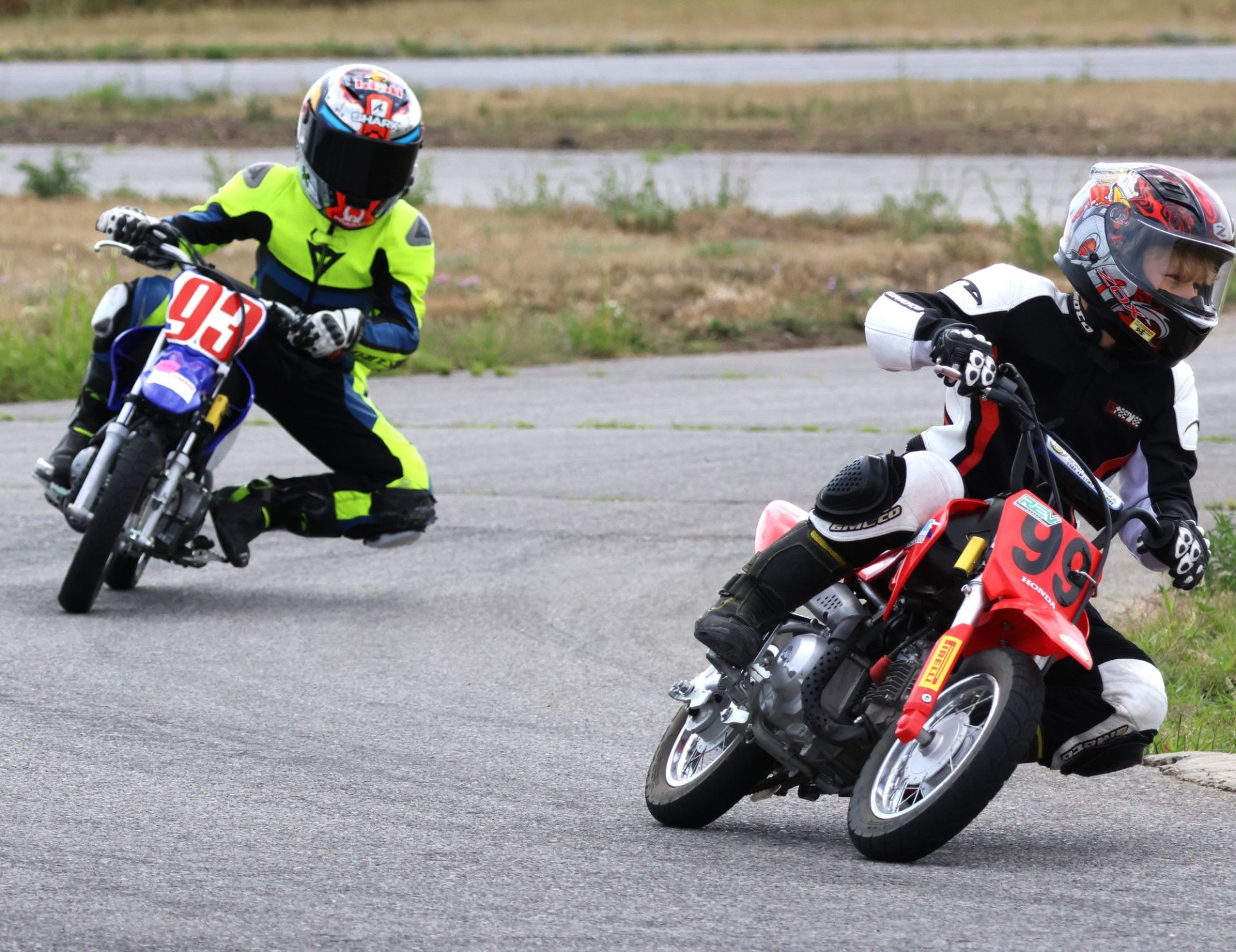 Early in the “Mini50” Moto4 race, eventual winner No. 99 Honda of Thorleif Grummett holds off arch-rival No. 93 Yam of Austin Da – after suffering a technical problem, Da dropped from the lead dice and Grummett earned first in his second career road race. Photo courtesy CSBK.