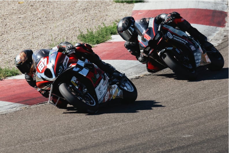 Justin Delong (187) leading Anthony Norton (1) in Open Superstock Race. Photo by Richard Jellerson