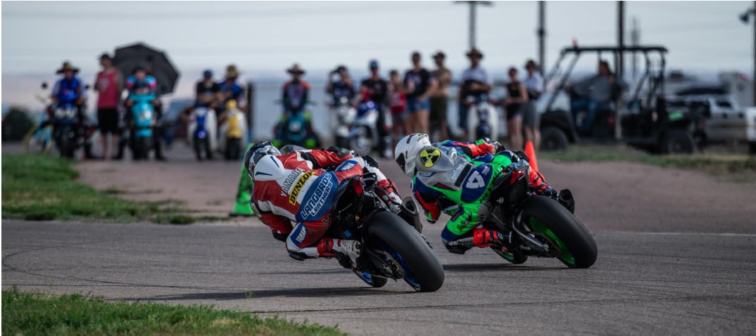 Cunha (95) sticks the pass onto Behmer (4) on the exit of turn 7. Photo by: Kelly Vernell