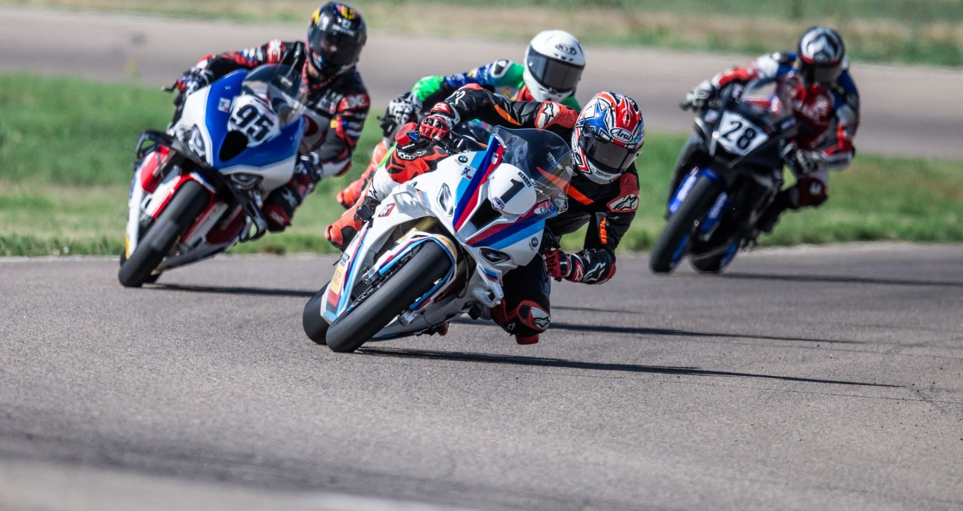 Matthew Cunha #95, Justen Behmer #4, Brad Hendry #1, David Lambert #28 attack turn 1 on the first lap of Race of the Rockies. Photo by: Kelly Vernell
