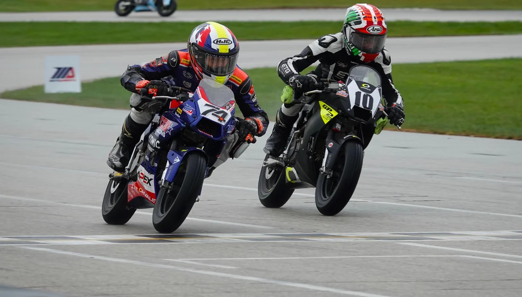 Kensei Matsudaira (74), making his final Mini Cup appearance, nips rival Mahdi Salem (10) at the finish line in Sunday’s final GP 190 race. Matsudaira won back the title that Salem took at the championships in 2024. Photo by Larry Lawrence