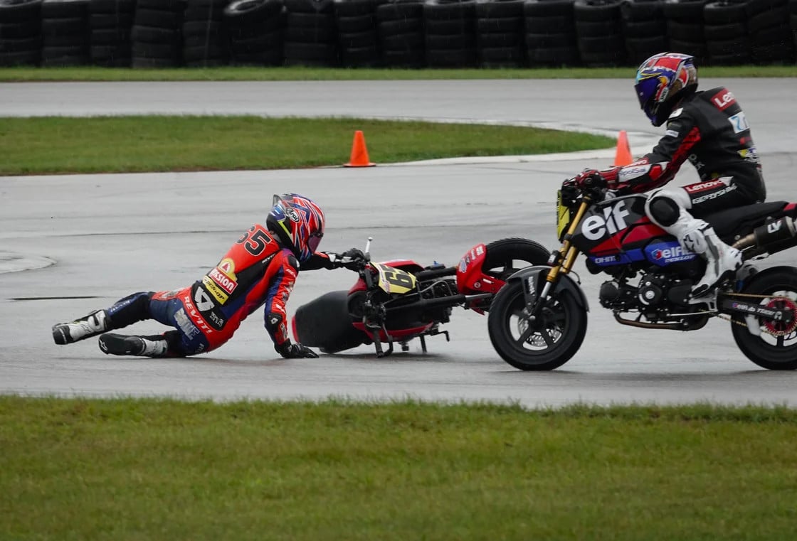 Bodie Paige fell off early in the Street GP race on Sunday but was able to pick up his Honda and quickly come back to win the race. Cooper Glover did a good job avoiding the downed Paige. Paige, a leading MotoAmerica Talent Cup rider, used the off-weekend to bring home a Mini Cup National Championship with a four-race sweep. Photo by Larry Lawrence
