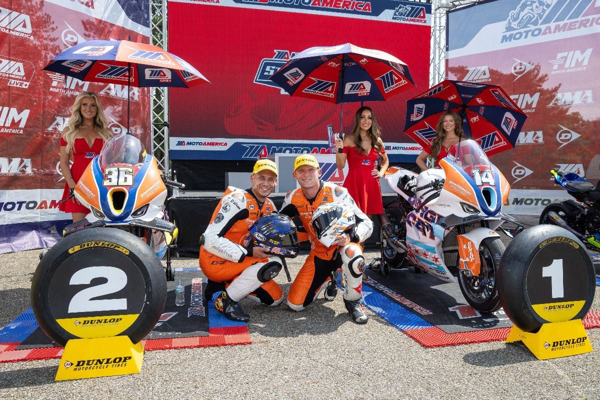 OrangeCat Racing riders Jayson Uribe (left) and Andrew Lee pose in winner's circle at Mid-Ohio Sports Car Course on Sunday after securing a 1-2 finish in the day's MotoAmerica Stock 1000 race. Photo by Brian J. Nelson