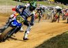 Tom Drane (59) leads the field into turn one during the AFT Singles presented by KICKER Main Event in Peoria. Photo by Tim Lester / courtesy American Flat Track.