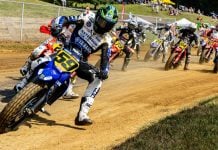 Tom Drane (59) leads the field into turn one during the AFT Singles presented by KICKER Main Event in Peoria. Photo by Tim Lester / courtesy American Flat Track.