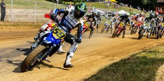 Tom Drane (59) leads the field into turn one during the AFT Singles presented by KICKER Main Event in Peoria. Photo by Tim Lester / courtesy American Flat Track.